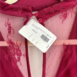 Mini romper with maxi lace overlay. Magenta color. NWT. Size medium.